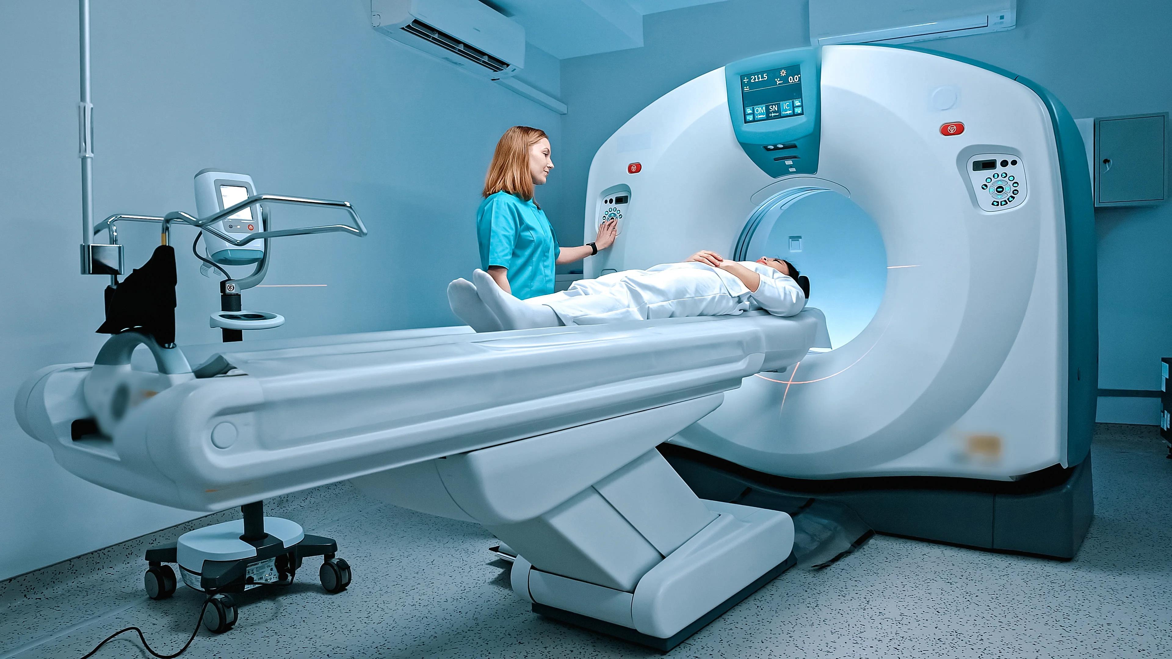 PET/CT Service: GE CT scanner with technologist and patient