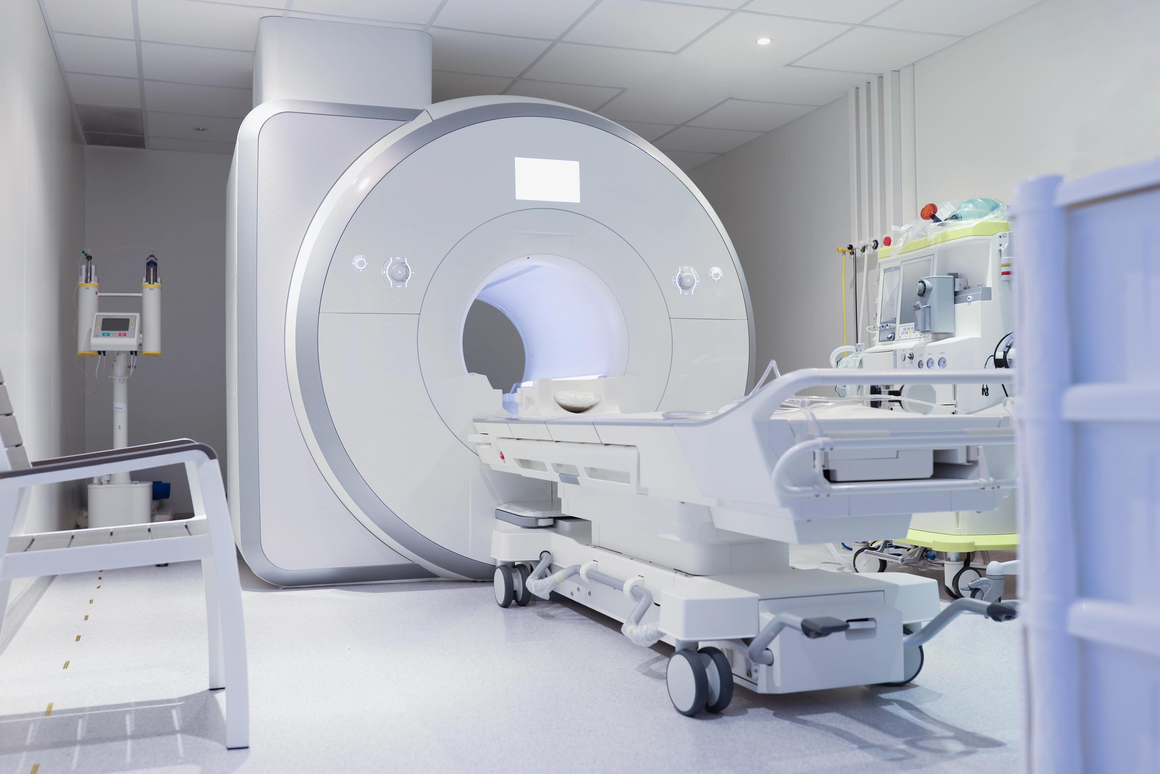 MRI Service: MRI scanner and patient table in a clinical imaging room